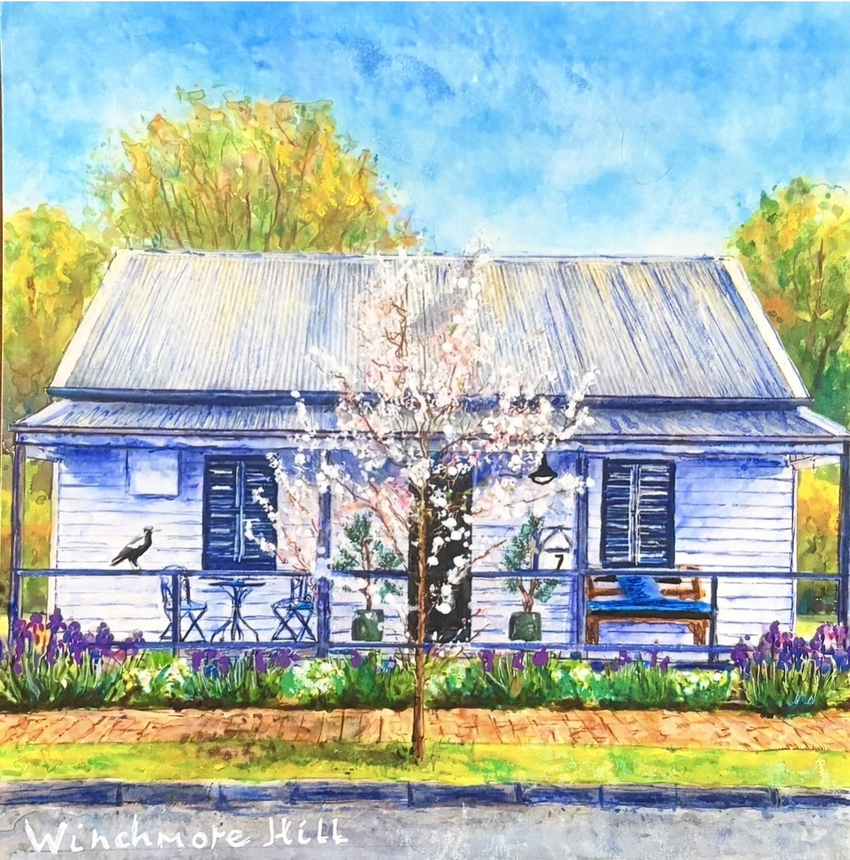 Winchmore Hill cottage with blossom tree, irises and magpie on the verandah